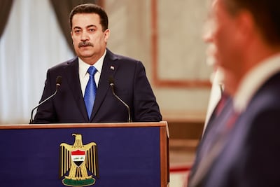 Iraqi Prime Minister Mohammed Shia Al Sudani speaks during a December press conference. AP