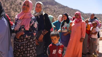Earthquake survivors queue for aid in Tinmel, Morocco, on Monday. Reuters