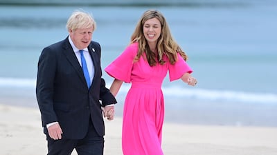 Carrie Johnson with her husband UK Prime Minister Boris Johnson at the G7 summit in Cornwall, south-west England. EPA