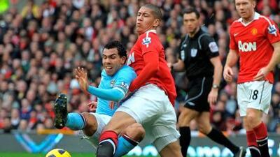 Manchester City’s Carlos Tevez faced his former team last season and received a warm welcome from Manchester United’s Chris Smalling.