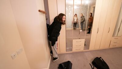 Kamila Starkova, 11, looks around the bedroom of her new home.