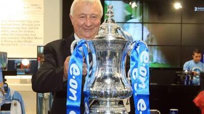 At Abu Dhabi’s Marina Mall, Mike Summerbee, club ambassador, beams at the sight of the cup he hoisted in 1969 as a player with Manchester City.