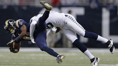 The Seahawks, in white, were riding the best start in club history and clung to the lead when they were forced to punt with just over five minutes left in the game. Michael Conroy / AP Photo