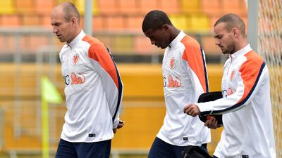 Netherlands players Arjen Robben, left, Georginio Wijnaldum and Wesley Sneijder are thinking about other things besides football. Nelson Almeida / AFP