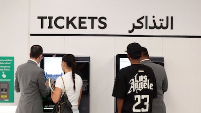 Passengers pick up their tickets for the momentous journey.