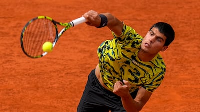 Carlos Alcaraz serves during his win over Alexander Zverev at the Madrid Masters on May 2, 2023. AP