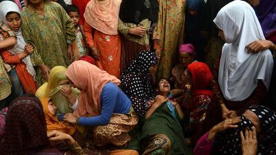 Kashmiri Muslim women mourn during the funeral of Kashmiri rebel Shahnawaz Ahmed alias Tahir Khan, of Hizbul Mujahideen at Tral, 40kms south of Srinagar. Tauseef Mustafa / AFP
