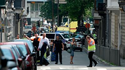 Police and ambulance are seen at the site where an armed man shot and killed police officers before being subdued by police in the eastern Belgian city of Liege on May 29, 2018. John Thys / AFP