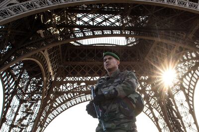 A French soldier stands guard at Eiffel Tower. David Ramos / Getty Images