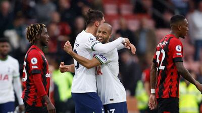 Tottenham's Lucas Moura, right, and Rodrigo Bentancur celebrate at the end of the match. AP