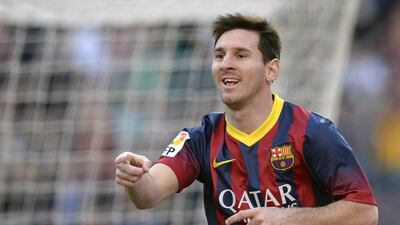 Lionel Messi reacts after scoring one of his three goals against Osasuna on Sunday. Lluis Gene / AFP / March 16, 2014
