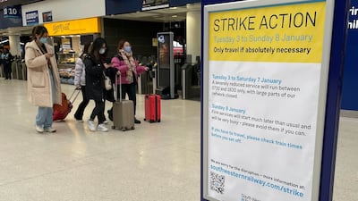 A sign at Waterloo station in London informing passengers of a strike by members of the Rail, Maritime and Transport union. PA