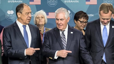 US secretary of state Rex Tillerson, centre, and Russian foreign minister Sergei Lavrov, left, at the Arctic Council meeting in Fairbanks, Alaska, on May 11, 2017, before US-Russian relations worsened over sanctions imposed by Washington and the retaliatory expulsion of American diplomats by Moscow in July. Nicholas Kamm / AFP