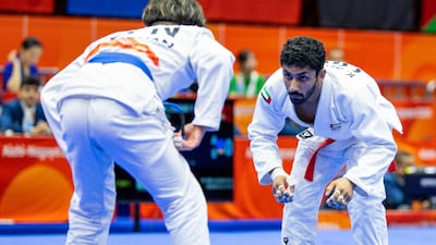 Khaled Al Shehhi, right, on his way to gold at the Asian Games 2026. UAEJJF