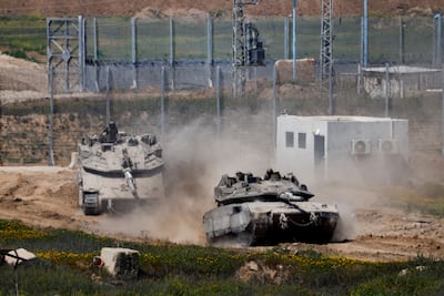 Israeli tanks enter Israel from Gaza on March 18. Reuters