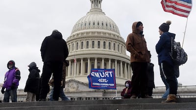 Supporters of US President Donald Trump hold a rally outside the US Capitol as they protest the upcoming electoral college certification of Joe Biden as president in Washington, DC. AFP