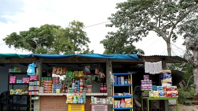 Staple items and hygiene products, most smuggled in from Colombia, at a stall next to a road in Boca del Grita, Venezuela. Carlos Garcia Rawlins/Reuters