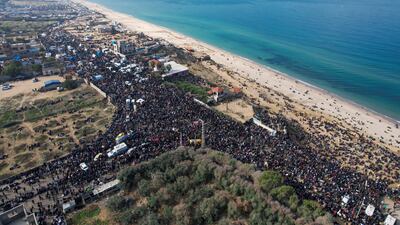 Palestinians wait to be allowed to return to their homes in northern Gaza after they were displaced to the south at Israel's order during the war. Reuters