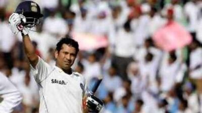 Sachin Tendulkar acknowledges the crowd after surpassing Brian Lara's record of 11,953 Test runs on Friday.