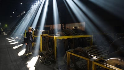 An employee inspects engineering spares in the melt shop. Oli Scarff / AFP