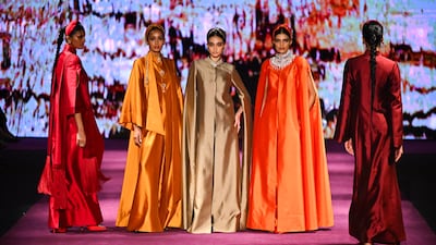 Models walk the runway at Tarun Tahiliani's show at Dubai Fashion Week. Getty Images
