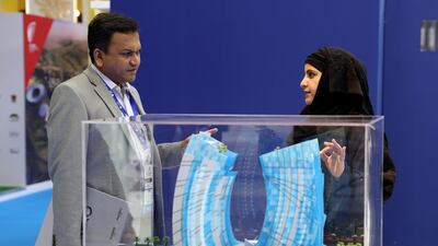 Visitors at the J1 project model. Chris Whiteoak / The National