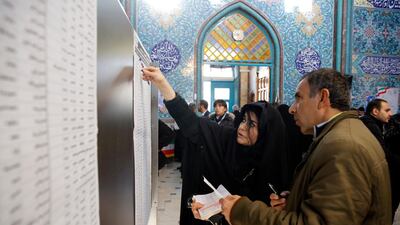 Iranians fill in their ballot papers at a polling station during the parliamentary elections in Tehran, Iran on 21 February 2020. Iranians head to polls amid a worsening economic crisis and escalating tensions with the United States. EPA