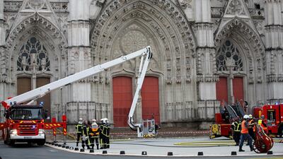 Firefighters work at the scene of a blaze at the cathedral. Reuters