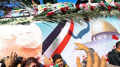 The coffins of Qassem Suleimani and Abu Mahdi Al Muhandis are transported atop a vehicle upon their arrival at Ahvaz International Airport in southwestern Iran. AFP