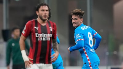 Atletico Madrid's Antoine Griezmann, right, celebrates after scoring the equaliser. AP