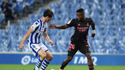Real Madrid forward Vinicius Junior takes on Aihen Munoz of Real Sociedad. Getty Images