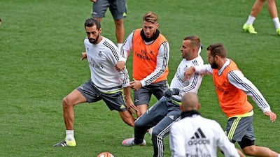 Real Madrid players warm up during the team's training session at AAMI Park in Melbourne, Australia on Tuesday. Joe Castro / EPA