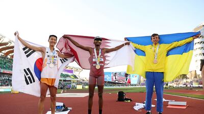 L-R: Silver medalist Sanghyeok Woo, gold medalist Mutaz Essa Barshim, and bronze medalist Andriy Protsenko. Getty