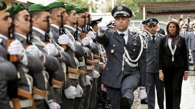 Raya Al Hassan reviews an honour guard on her first day as interior minister in Beirut. AP Photo