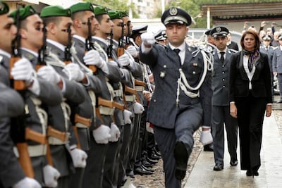 Raya Al Hassan reviews an honour guard on her first day as interior minister in Beirut. AP Photo
