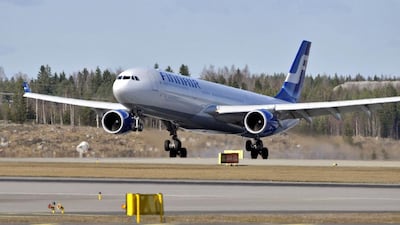 A Finnair jetliner lands at the Helsinki-Vantaa International Airport in Helsinki. Jussi Nukari / AFP