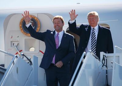 President Donald Trump arrives with Republican senator Dean Heller for a rally in Elko, Nevada. AP Photo