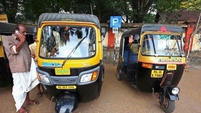 A driver wearing a mundu waits for customers in Varkala, near Kerala's capital, Thiruvananthapuram. EyesWideOpen / Getty Images