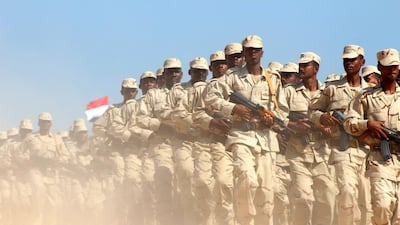 Yemeni pro-government forces on parade as Saudi and US ambassadors to Yemen arrive at Mukalla airport. AFP