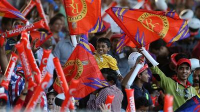 An excited crowd watching the IPL match between Royal Challengers Bangalore and Delhi Daredevils at Sharjah Cricket Stadium in Sharjah. Pawan Singh / The National