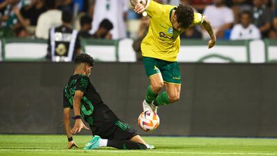 Al Khaleej forward Ivo Rodrigues fights for the ball with Al Ahli midfielder Ziyad Al Johani. Getty