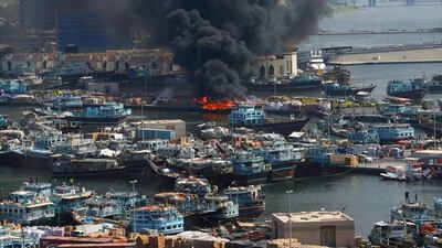 A dhow on fire at Dubai Creek. Courtesy Aletihad