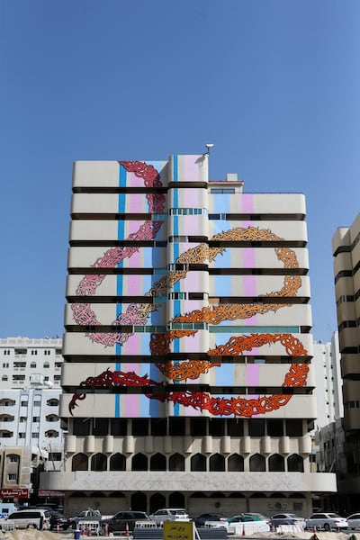 SHARJAH, UAE. February 15, 2015 - Street artist eL Seed painted an abandoned building on Bank Street as part of the new initiative by the Sharjah government to bring art into public places, February 15, 2015. (Photos by: Sarah Dea/The National, Story by: Anna Seaman, Arts and Life) *** Local Caption *** SDEA150215-elseed04.JPG