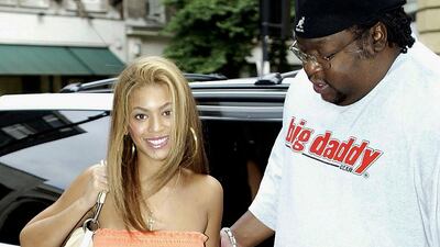 Beyonce, in orange strapless velour, leaves Radio 1 on July 4, 2003 in London. Getty Images