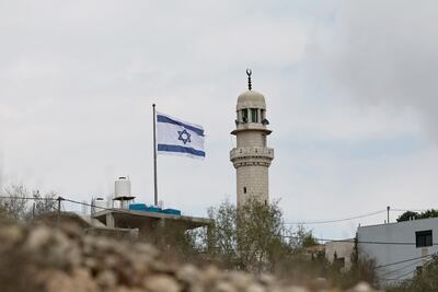 An Israeli flag flutters near a settler outpost in the occupied West Bank. EPA