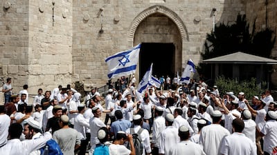 Israelis wave flags and chant outside Damascus Gate. Reuters