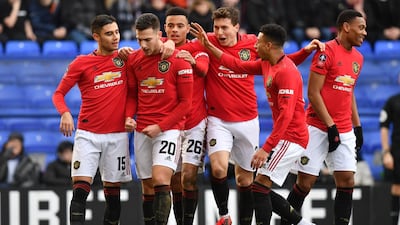 Manchester United's Diogo Dalot, second left, celebrates after scoring their second goal. AFP