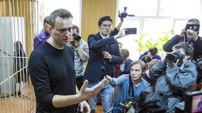 Russian opposition leader Alexei Navalny, foreground, speaking to press in a court room in Moscow, Russia on March 27, 2017 after his arrest for organising protests which the Kremlin called 'a provocation and a lie'. Denis Tyrin/AP Photo