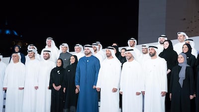 Sheikh Mohamed bin Zayed Al Nahyan, Crown Prince of Abu Dhabi and Deputy Supreme Commander of the UAE Armed Forces, stands for a group photograph during the launch of the National Experts Programme, at The Founders Memorial. Seen with Ohood Khalfan Al Roumi, UAE Minister of State for Happiness and Wellbeing, Mohamed Mubarak Al Mazrouei, undersecretary of the Crown Prince Court of Abu Dhabi, Ahmed Taleb Al Shamsi, director of the National Experts Programme, Mohamed Al Abbar, founder and chairman of Emaar Properties and board member of Eagle Hills, Sheikh Abdulla bin Mohamed Al Hamed, chairman of the Health Department and Abu Dhabi Executive Council Member, Khaldoon Khalifa Al Mubarak, CEO and managing director of Mubadala, chairman of the Abu Dhabi Executive Affairs Authority and Abu Dhabi Executive Council Member and other dignitaries. Hamed Al Mansoori / Ministry of Presidential Affairs