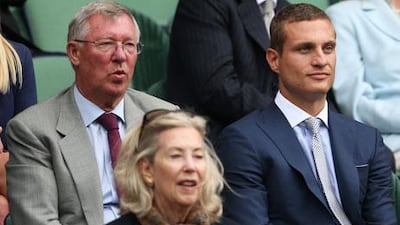 Sir Alex Ferguson, left, and Nemanja Vidic, of Manchester United, were at Centre Court to watch Andy Murray play. Clive Brunskill / Getty Images